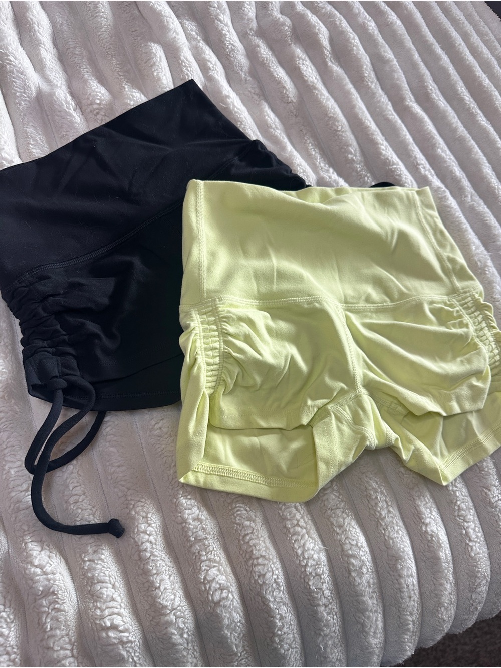 Two pairs TNA side scrunch shorts
